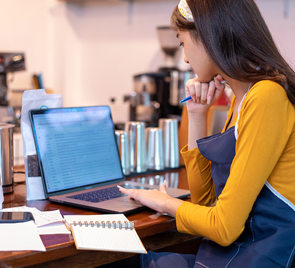 young-woman-using-laptop-office